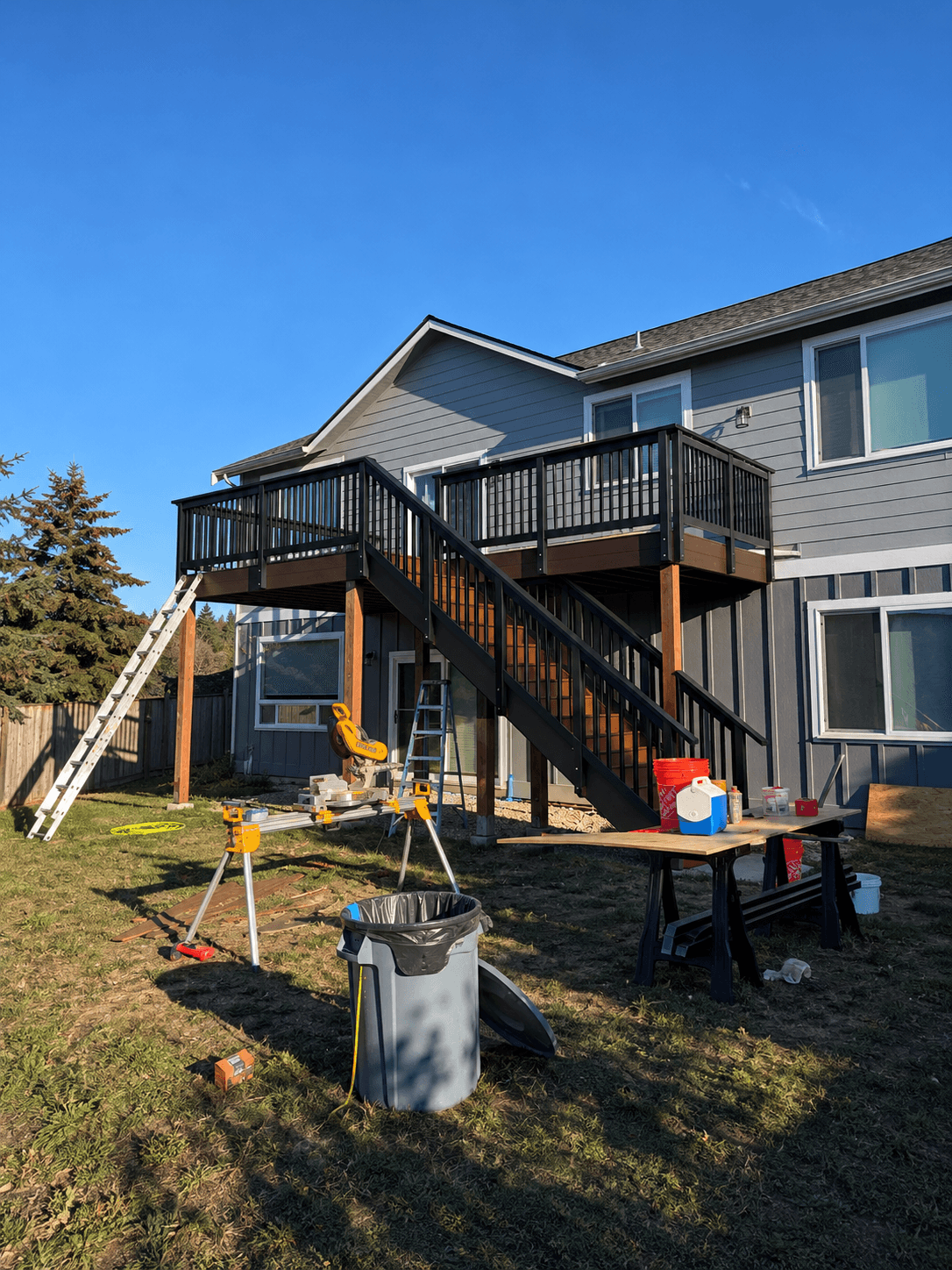 Deck and stairs mid-build with tools on site